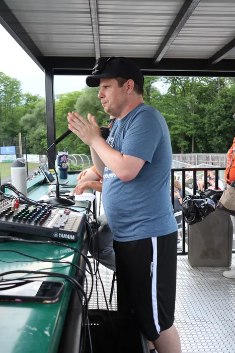 Arc Otsego staff member running sound at a community outing