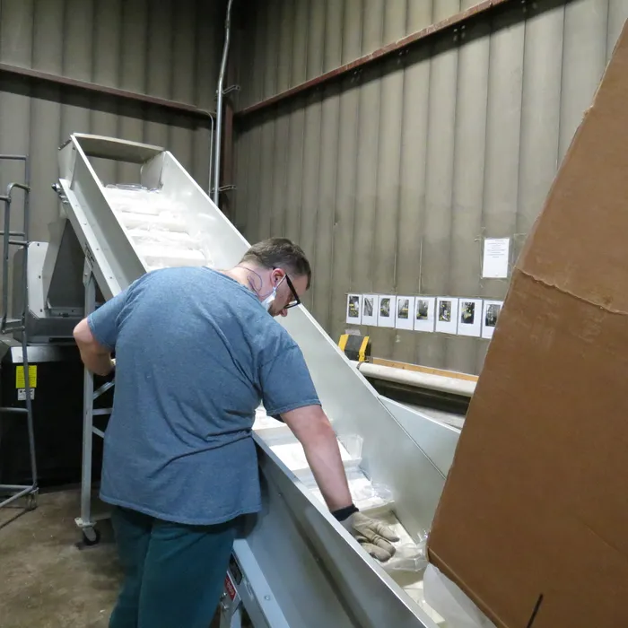 Creekside Industries staff member at work on the production line